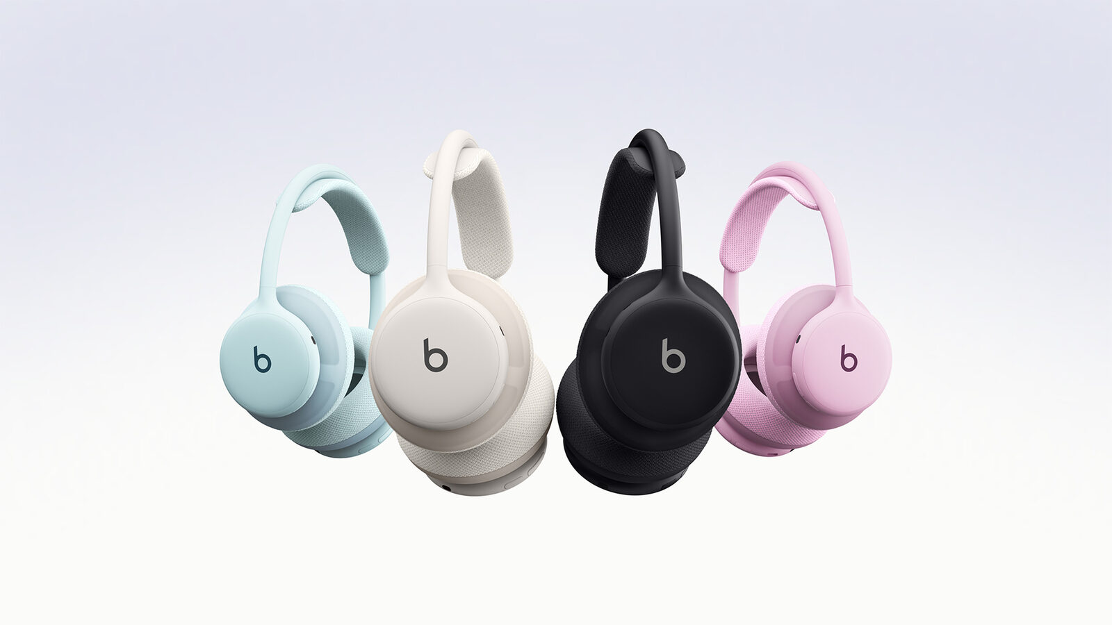 Vier Beats 360-koptelefoons naast elkaar in blauw, gebroken wit, zwart en roze