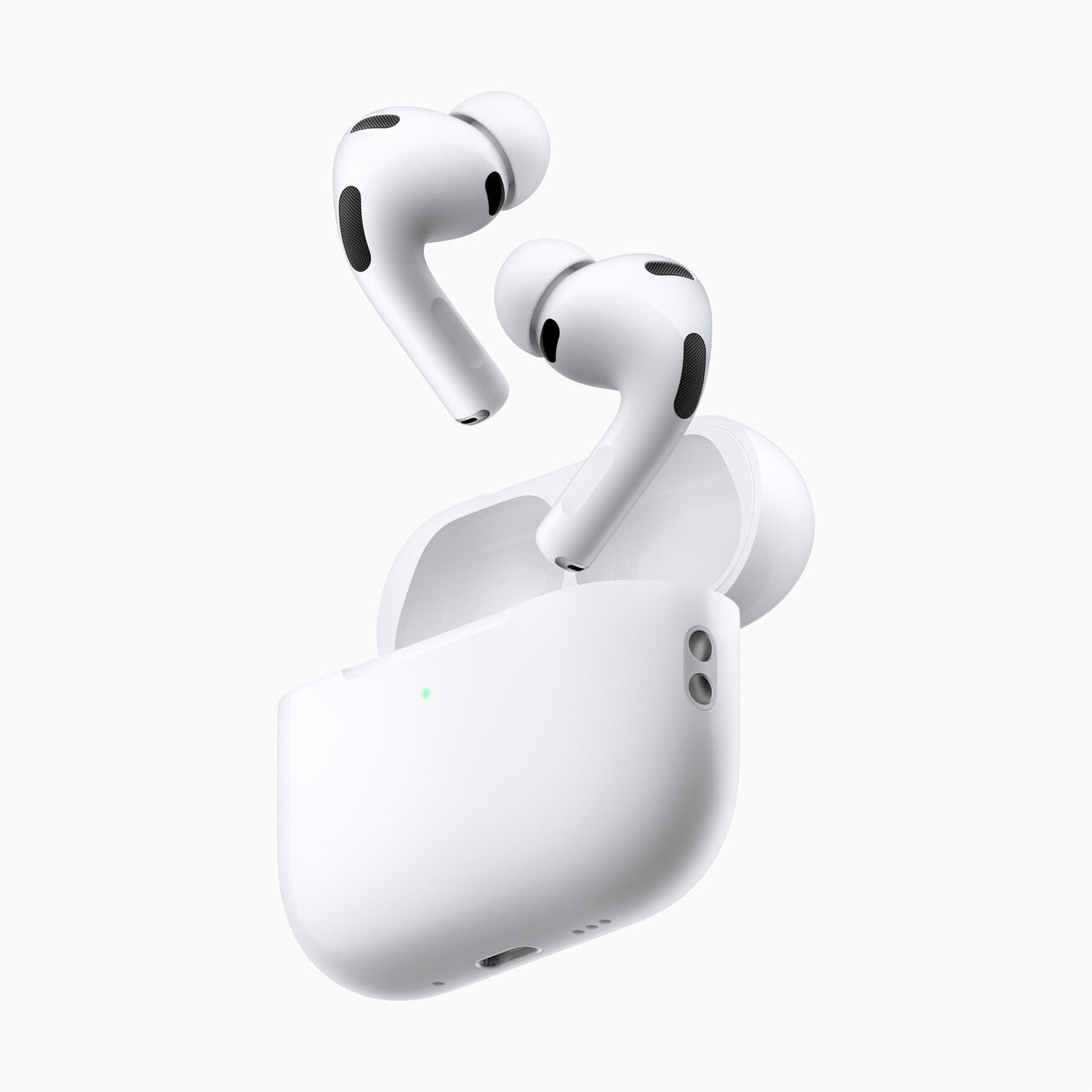 Açık MagSafe şarj kutusunun üzerinde havada duran beyaz AirPods Pro 3 kulaklıklar