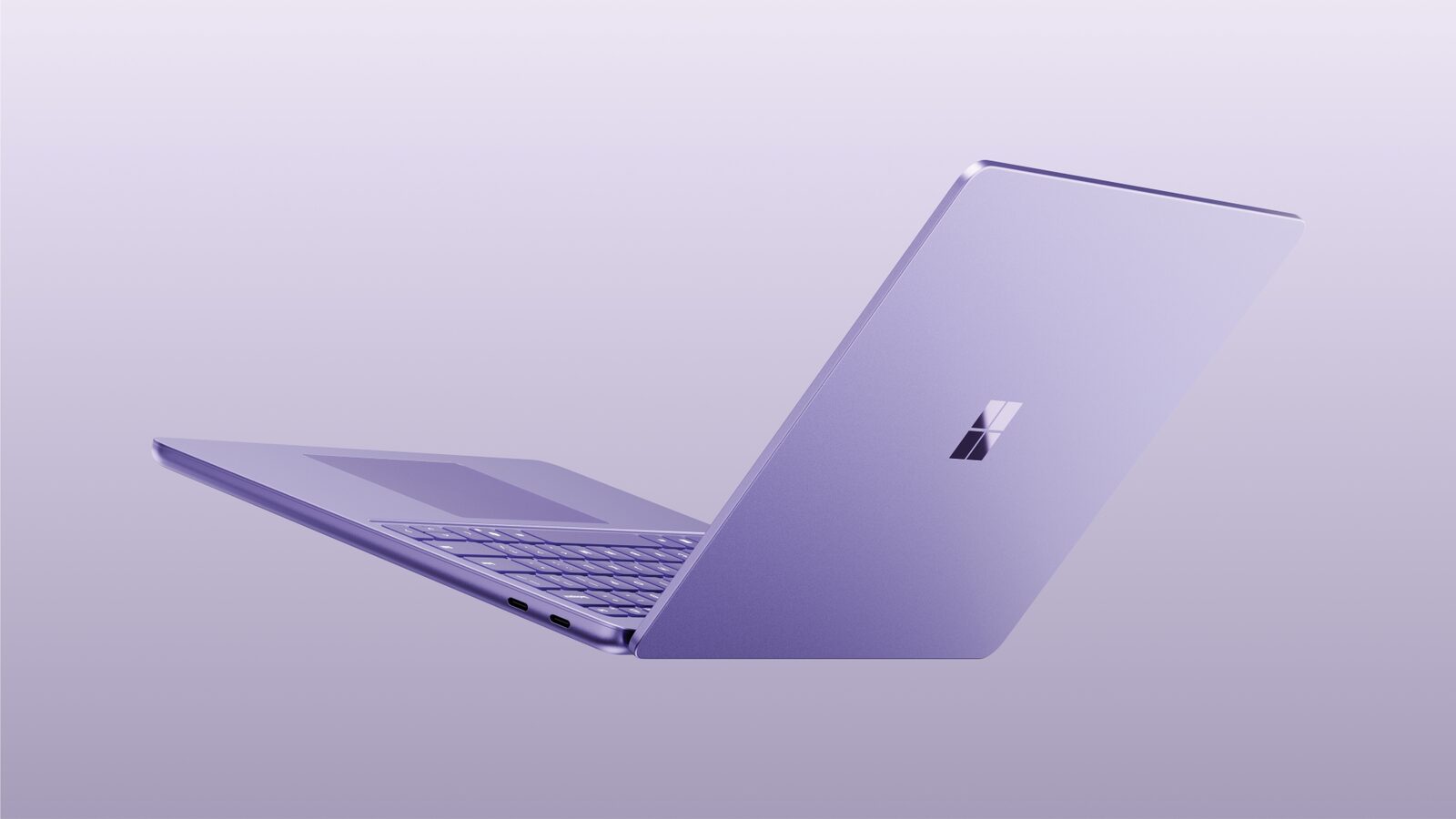 Surface Laptop 13 Zoll in Violett, schräg von hinten mit geöffnetem Display
