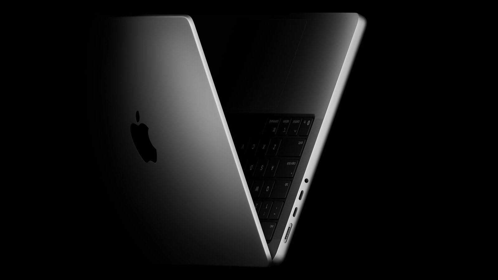 L'attuale MacBook Pro 14 pollici con chip M5, semiaperto su sfondo nero