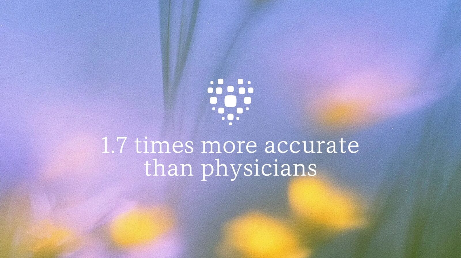 Offizielles Motiv von Microsoft AI mit Herz-Symbol und dem Satz „1.7 times more accurate than physicians“ vor unscharfen Blumen