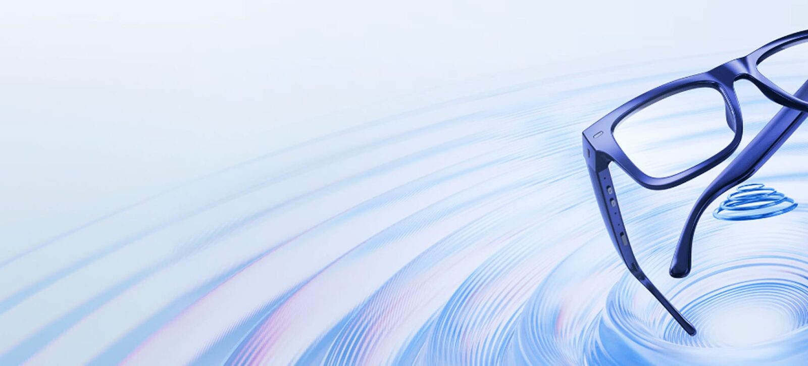 Occhiali Nuance Audio con montatura blu sospesi sopra onde azzurre, immagine ufficiale del sito Nuance Audio
